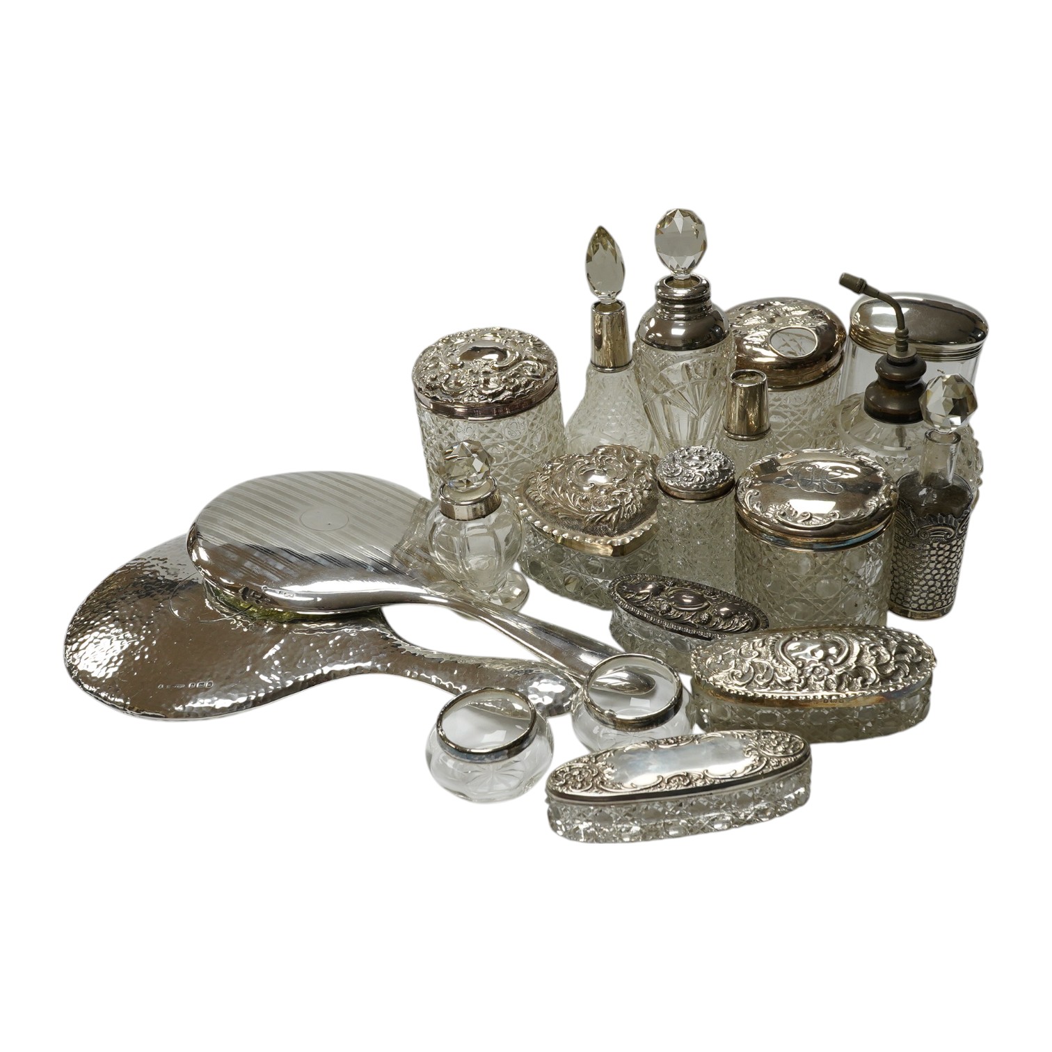 Two silver mounted hand mirrors and a collection of seventeen assorted silver mounted toilet jars. Condition - poor to fair